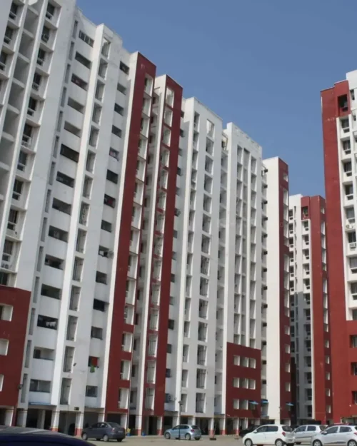 BTL activation setup by BrandLand featuring a high-rise residential backdrop with bold red and white branding elements.