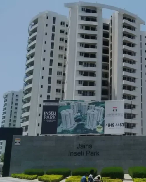 BTL activation setup by BrandLand at Jains Inseli Park, Chennai featuring a large outdoor billboard display in front of a residential high-rise.