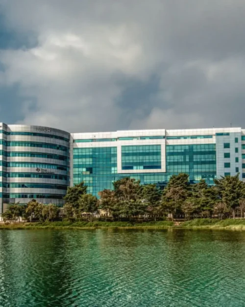 BTL activation setup by BrandLand at a corporate tech park with modern glass building backdrop and branded promotional installation.