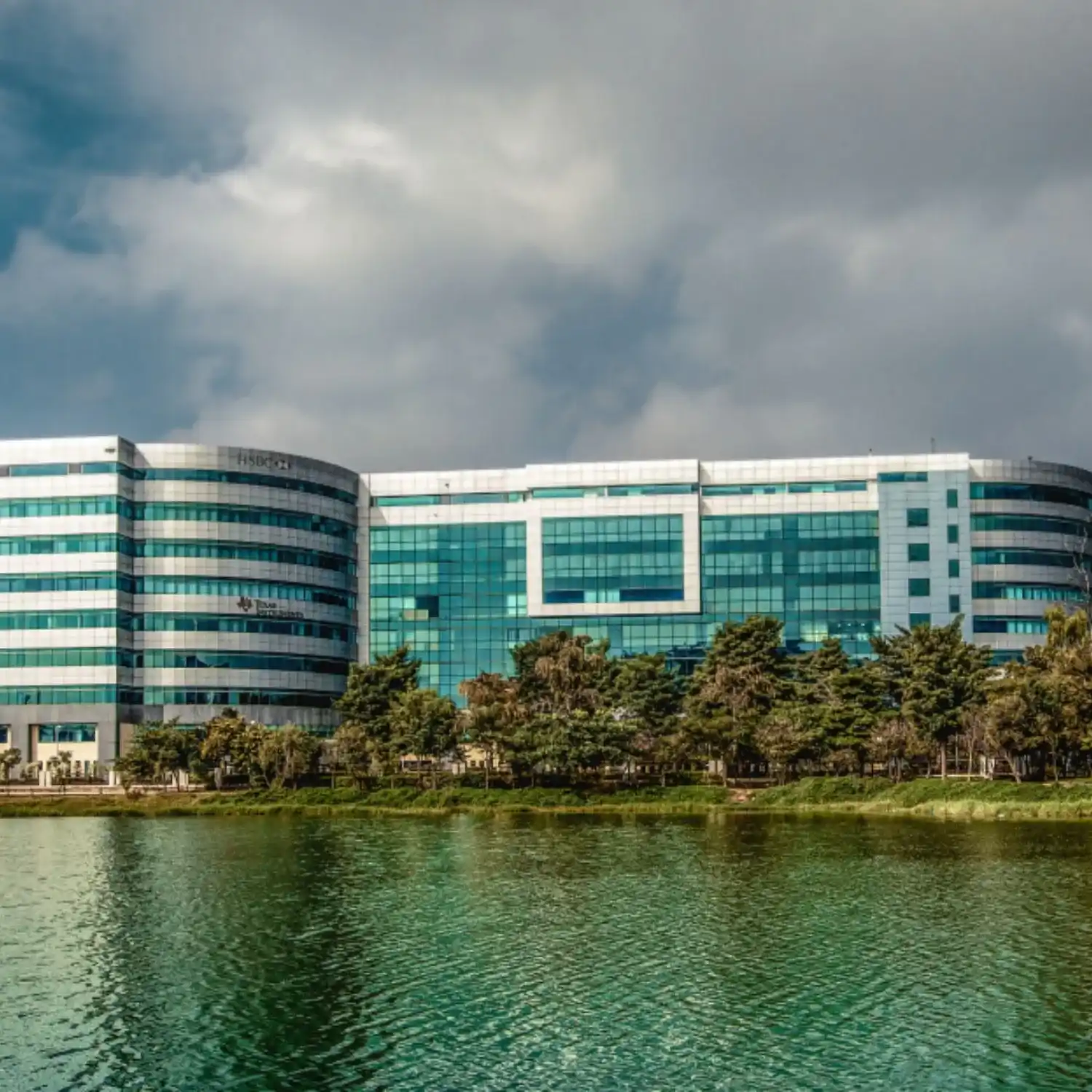 BTL activation setup by BrandLand at a corporate tech park with modern glass building backdrop and branded promotional installation.